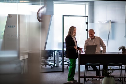 Two people in front of a PC