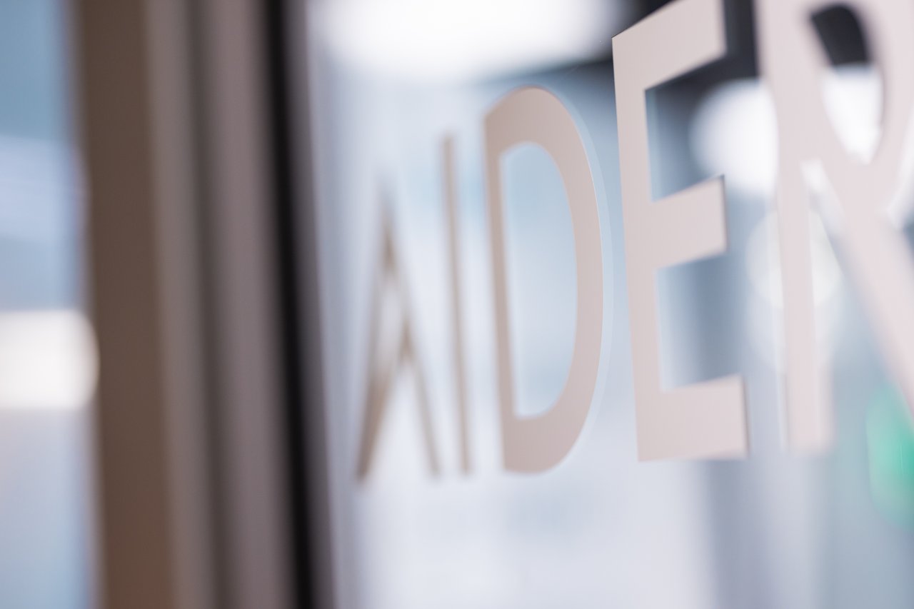 Glass wall with the text Aider