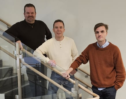 three men on a staircase
