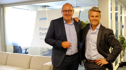 Two men smiling for the camera